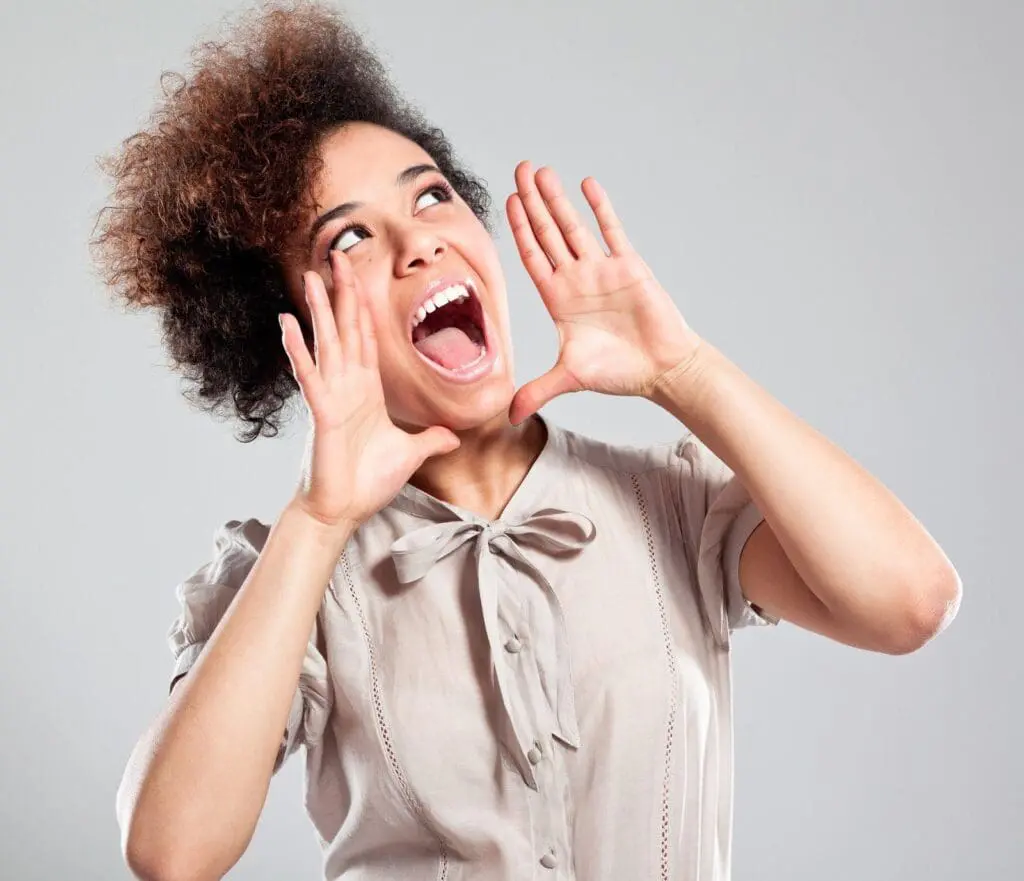 Residential Pavers - Marketing to Turn Prospects into Promoters - Word of Mouth - young woman with her mouth open and hands on either side like she's yelling